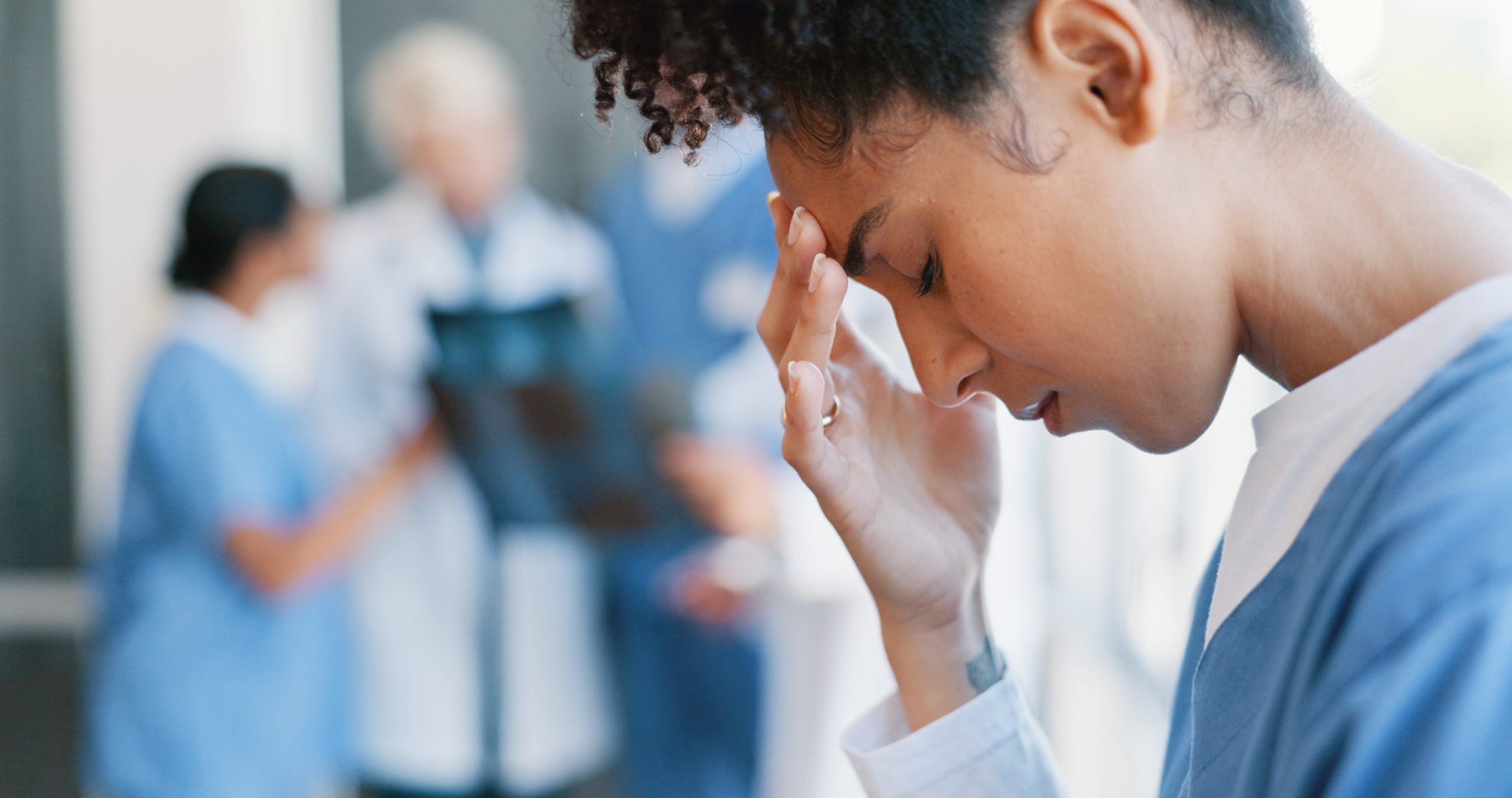 Nurse at work experiencing fatigue and burnout