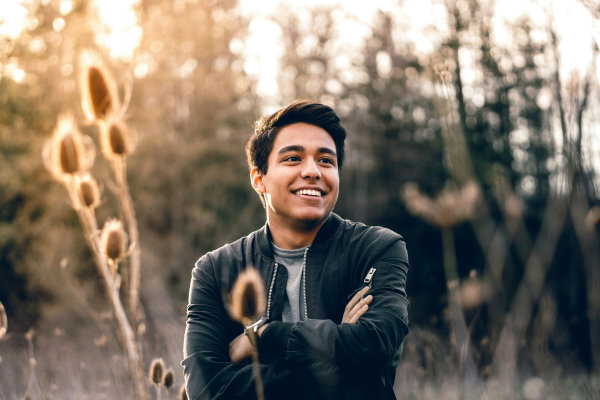 Hispanic man in Edina MN feeling relieved after grief therapy session ADHD Therapy - Edina MN - Minneapolis MN - Black woman with ADHD speaking with her therapist