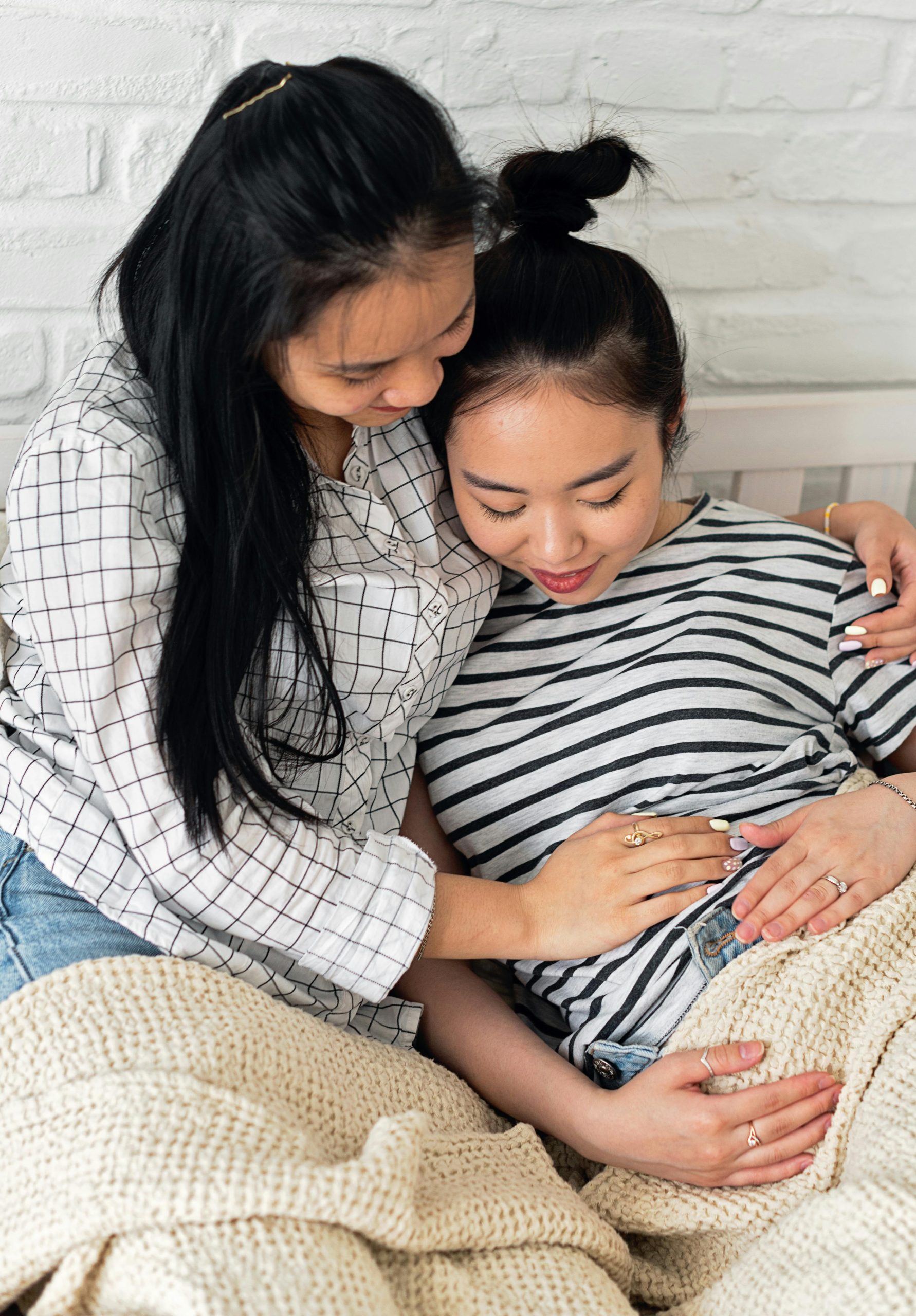 LGBTQIA+ Couple Comforting each other during pregnancy