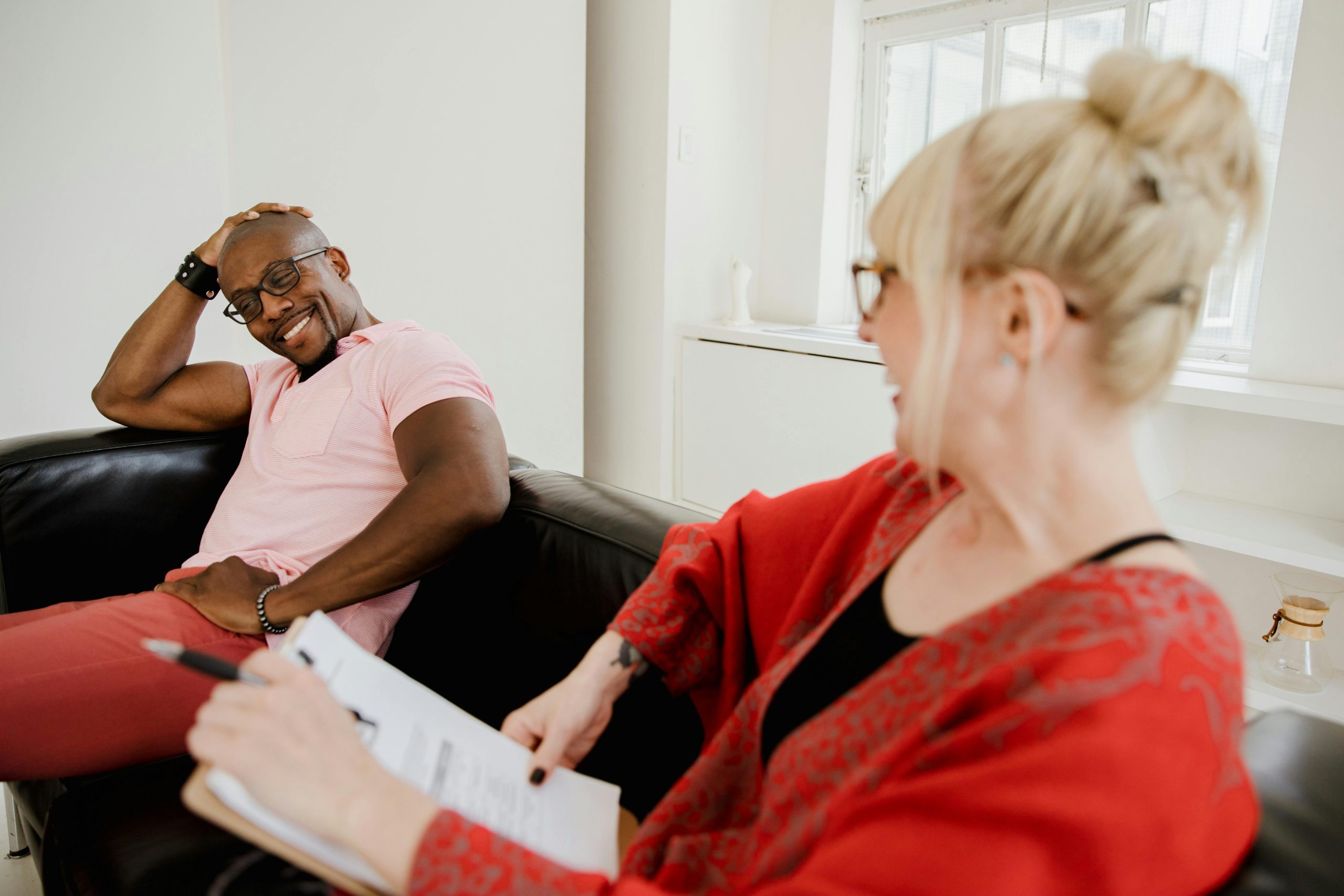 pexels-rdne-9065296 BIPOC therapy, black man smiling and laughing during his therapy session in Edina, MN
