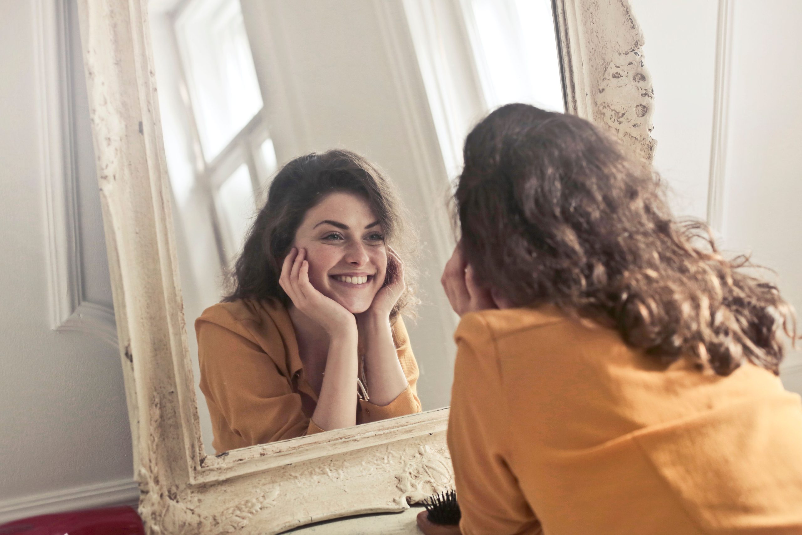 Woman Looking At Herself In Mirror - Self-Acceptance In DBT