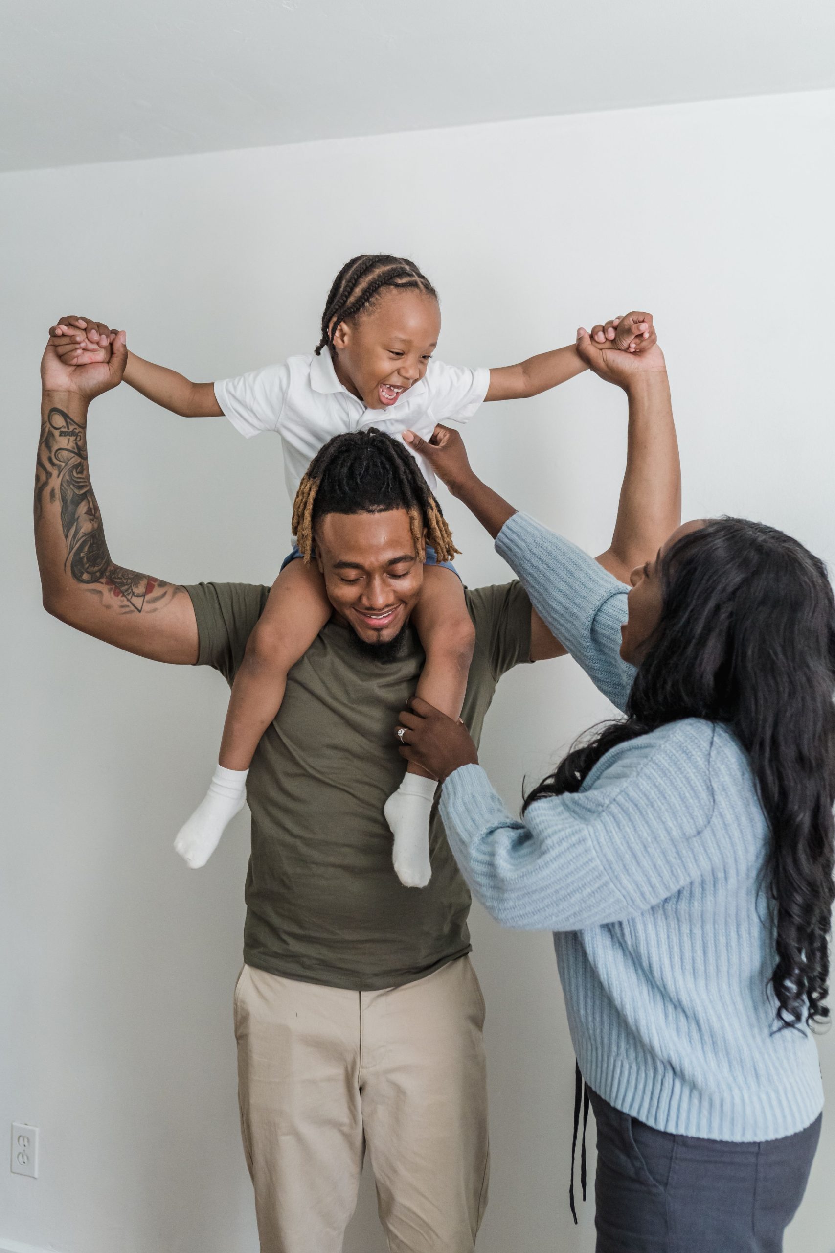 Two parents playing with their child. therapy services in South Minneapolis, MN